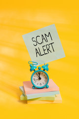 Handwriting text Scam Alert. Conceptual photo unsolicited email that claims the prospect of a...