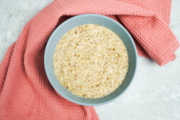 Healthy breakfast on a light background with place for text. 
Flaxseed porridge. 