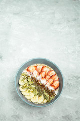 Flax porridge on a light background with fruit. 
Varinat of tasty and healthy breakfast.