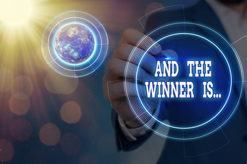 Conceptual hand writing showing And The Winner Is. Concept meaning announcing an individual or...