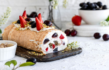 Meringue roll with fresh berries and cream cheese