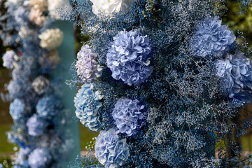 Beautiful decorated ceremony zone, blue flowers.