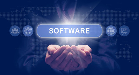 Businessmans cupped hands holding an Software business concept on a computerised display.