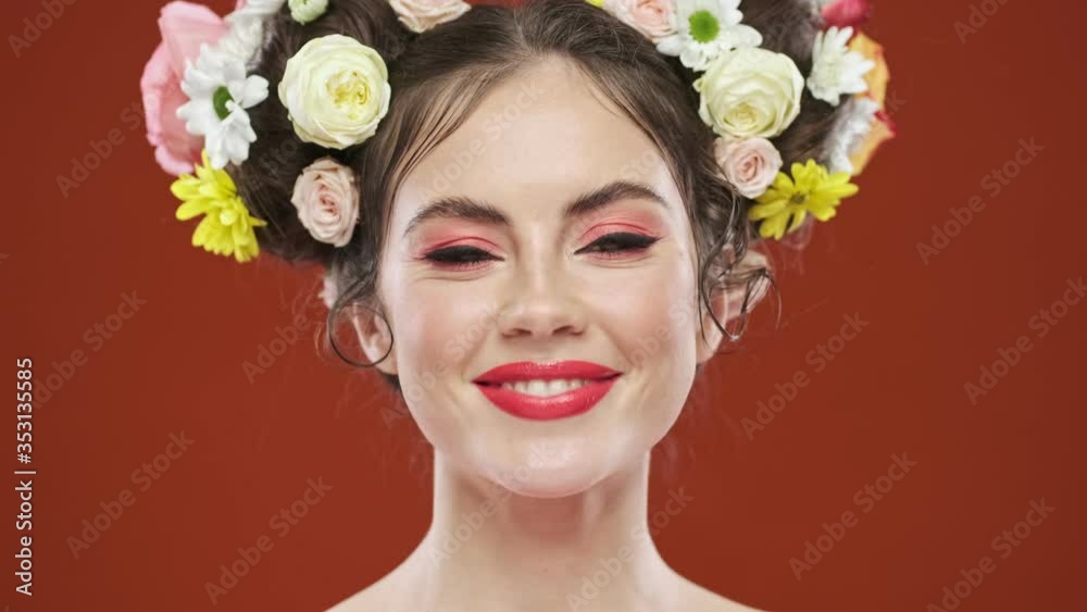 Sticker a beautiful smiling young brunette woman with an amazing floral hairstyle is posing isolated over re