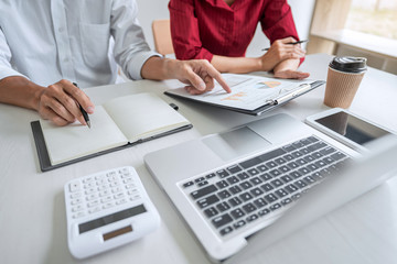 Teamwork of business casual colleagues, consultation new strategy plan business and market growth on financial document graph report, conference to making growth profit, Partner meetings and briefing