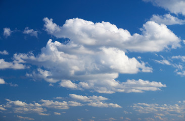 Bright beautiful blue sky with soft clouds, bright sunny day