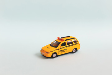 Yellow taxi car model. idea, symbol, concept of urban service and delivery. Mobile online...