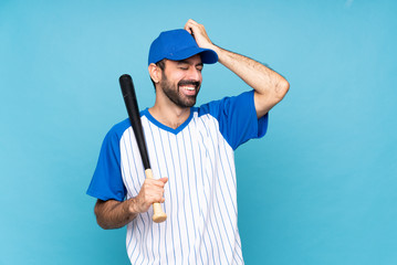 Young man playing baseball over isolated blue background has realized something and intending the solution