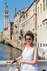 Beautiful Tourist Woman with White Dress  in Venice ,Italy 