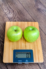 Digital Kitchen Scale with Green Apples .Healthy Eating Concept .