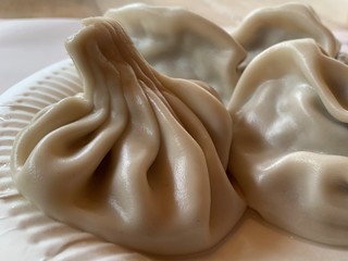 Khinkali close-up. Georgian national dish. Caucasian cuisine, a dish of dough and meat.