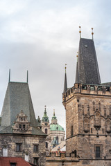 Obraz premium Malostranska panorama, with the lesser town bridge tower of Charles Bridge, also called malostranska mostecka vez and St Nicholas Church, also called Kostel Svateho Mikulase, Prague, Czech Republic.