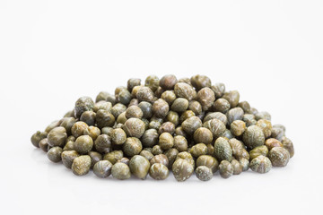 Capers isolated on a white background. Bunch canned pickled or salted capers.