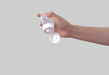 A hand is holding an open clear bottle of hand sanitizer on grey background 