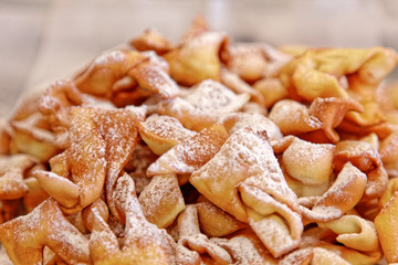 Sweet deep fried brushwood dessert traditional cookies with powdered sugar