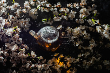Tea ceremony set. Grass teapot with spring flowers