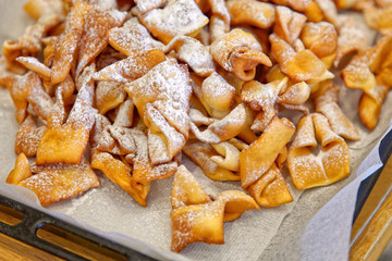 Sweet deep fried brushwood dessert traditional cookies with powdered sugar
