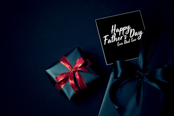 Happy Father's Day background concept with top view of black gift box
