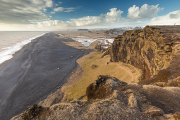 View of Kirkjufjara black sand beach from Dyrholaey promontory. Vik I Myrdal village, South Iceland