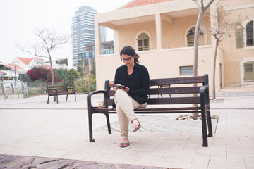 business woman working on tablet outdoor 