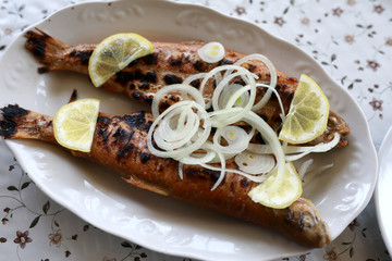 Grilled trout with onions