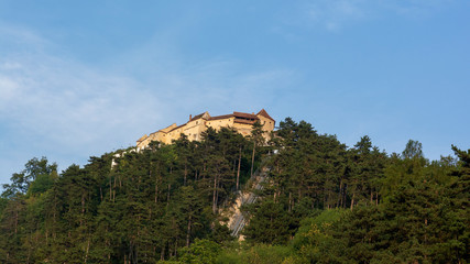 Fototapeta na wymiar Rasnov Fortress (Cetatea Râșnov) at the top of the hill. Brasov County, Romania