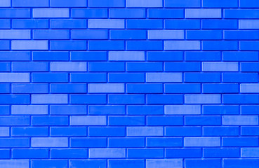 Obraz premium texture of blue brick wall close up , neon bricks background macro , bricklaying surface backdrop