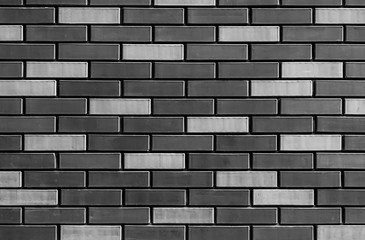 texture of gray brick wall close up , black and white bricks background macro , monochrome...