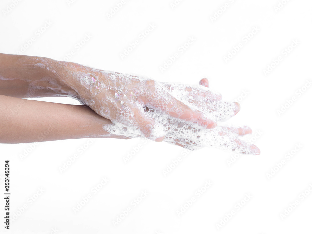 Wall mural wash two hands with soap on white background. hygiene concept.