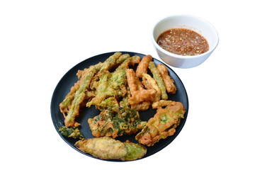 batter fried vegetable coating flour on plate dipping Thai spicy shrimp paste sauce in cup