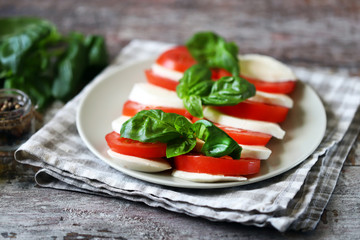 Selective focus. Italian caprese salad. Cooking at home.