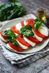 Selective focus. Italian caprese salad. Cooking at home.