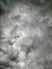 Black clouds formed before the rain, used for make a background image. Rain clouds background.Clouds become dark gray like a big smoke before rainfall. Thunderstorm is a storm with lightning and thund