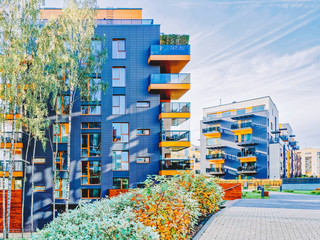 Naklejka premium Modern glass apartment buildings and Birch trees_4x3