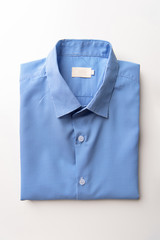 New Light Blue Men's shirts Folded on white background,