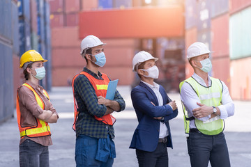Coronavirus Disease or COVID can spread easily without mask. Quarantined masked workers protect spreading of Covid 19 by wearing face masks. Workers are engineer wear masks during quarantine time.