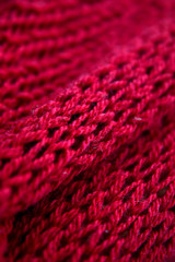 Detail of the handmade red knitting texture