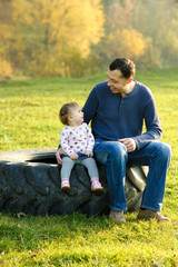 father and little daughter in nature