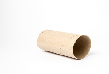 Image of cardboard toilet paper roll shot on white background in a studio with professional lighting for ecommerce. global pandemic people stacking up on toilet roll bulk buying and running out