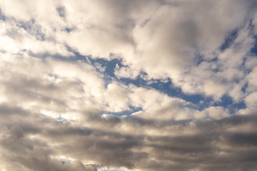 cloudy heavy dark sky, clouds from the inside illuminated by the sun