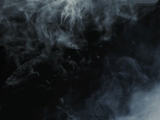 white smoke on dark background