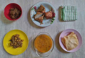 Variety of delicious Indonesian typical home cooked dishes served on the table on Eid al-Fitr from high angle view