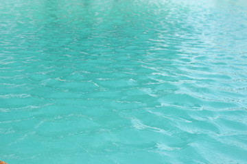Fototapeta na wymiar wave on the surface of water pool background