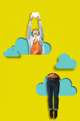 Man jumping with tablet. A person flying higher than blue clouds of paper on yellow sky background....