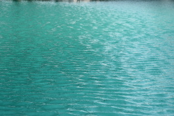 Fototapeta na wymiar wave on the surface of water pool background