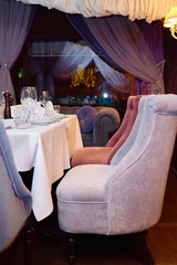 Holiday dinner table served for banquet in restaurant, copy space