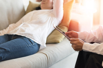 Healthcare technology concept of professional psychologist doctor consult in psychotherapy session or counsel diagnosis health with tablet.