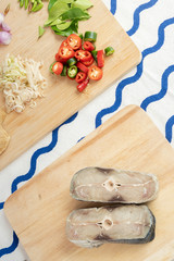 Dry salted fish on wooden background