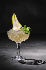 Pear juice with mint and hard shadows