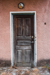 Old wooden door. Abandoned house.